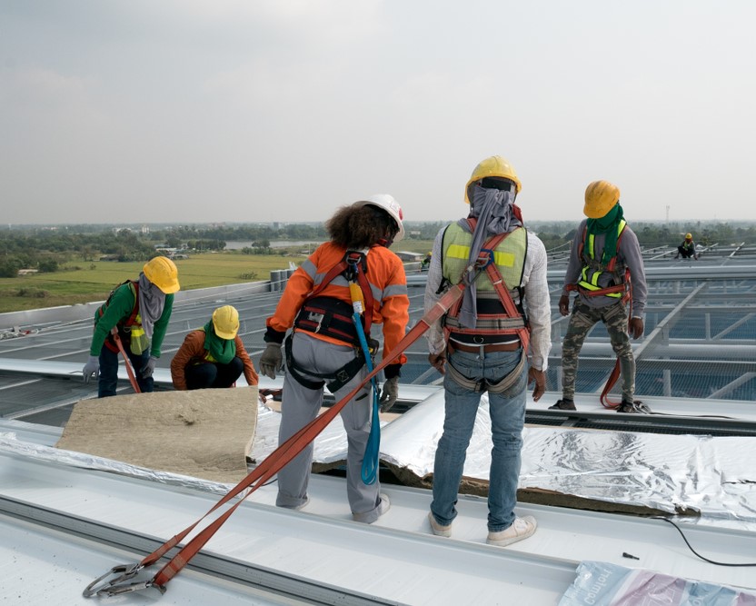 Construction,Worker,Wearing,Safety,Harness,And,Safety,Line,Working,On, Commercial Insulation